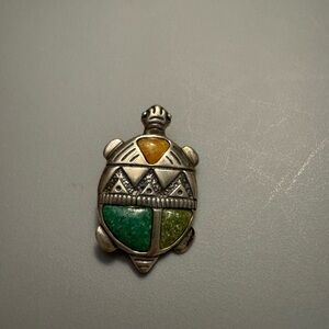 Carolyn Pollack turtle pin and pendant in sterling silver and stones.